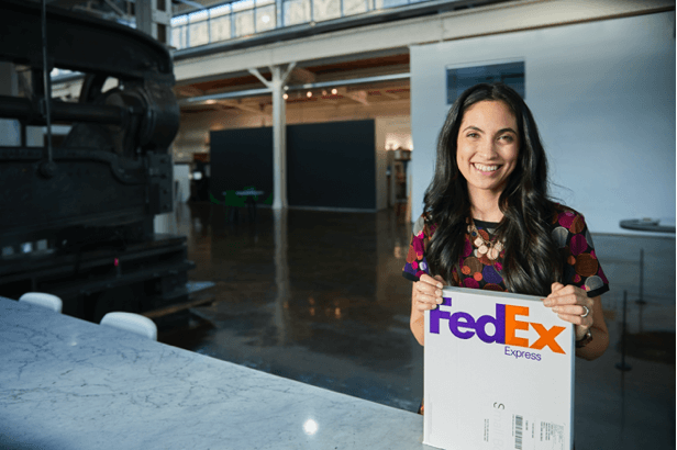 Woman holding a FedEx box