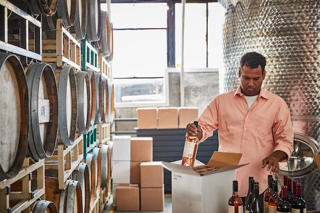 man packing wine shipment
