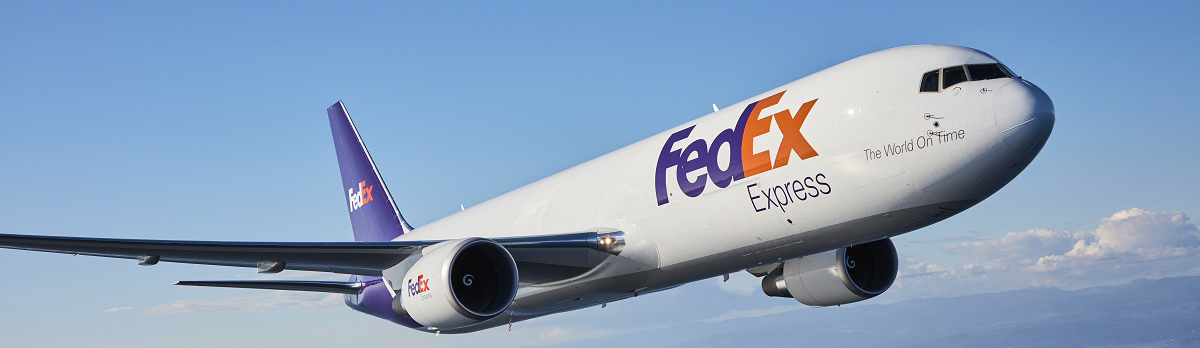 FedEx plane flying over islands