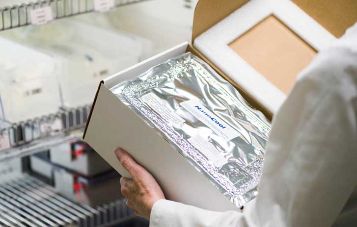 Woman holding FedEx boxes
