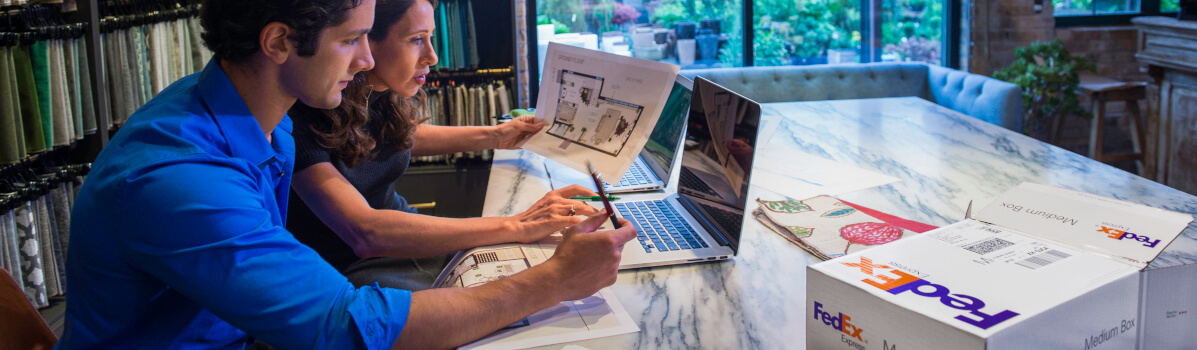 Two people working at a desk