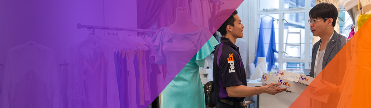 FedEx worker handing packages to a merchant