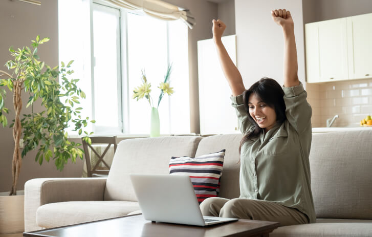 A woman celebrating with her arms up