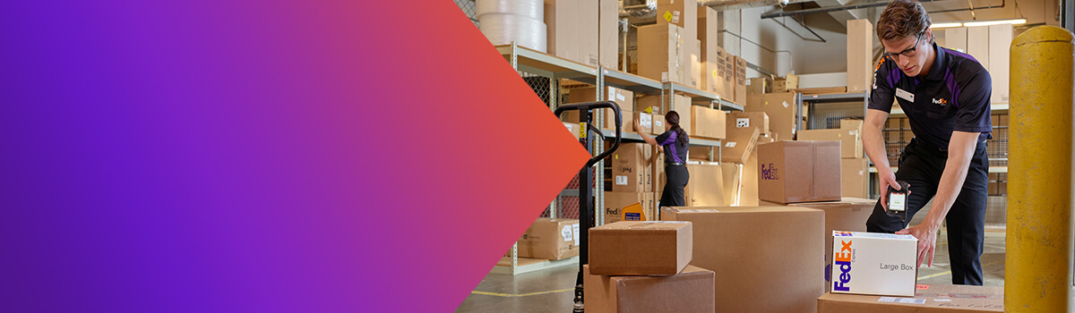 FedEx working scanning a box