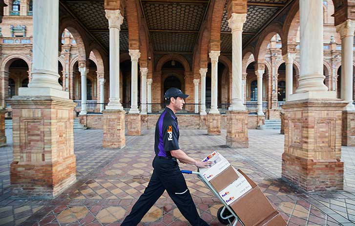 FedEx Worker carrying packages