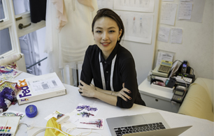Woman smiling while sitting at desk