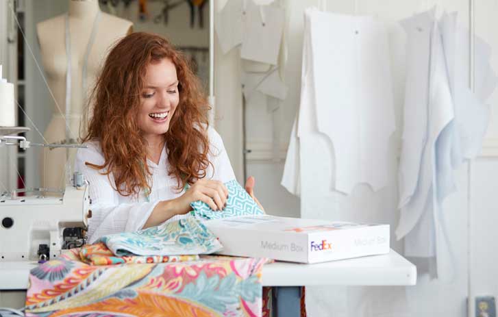 Woman opening FedEx box