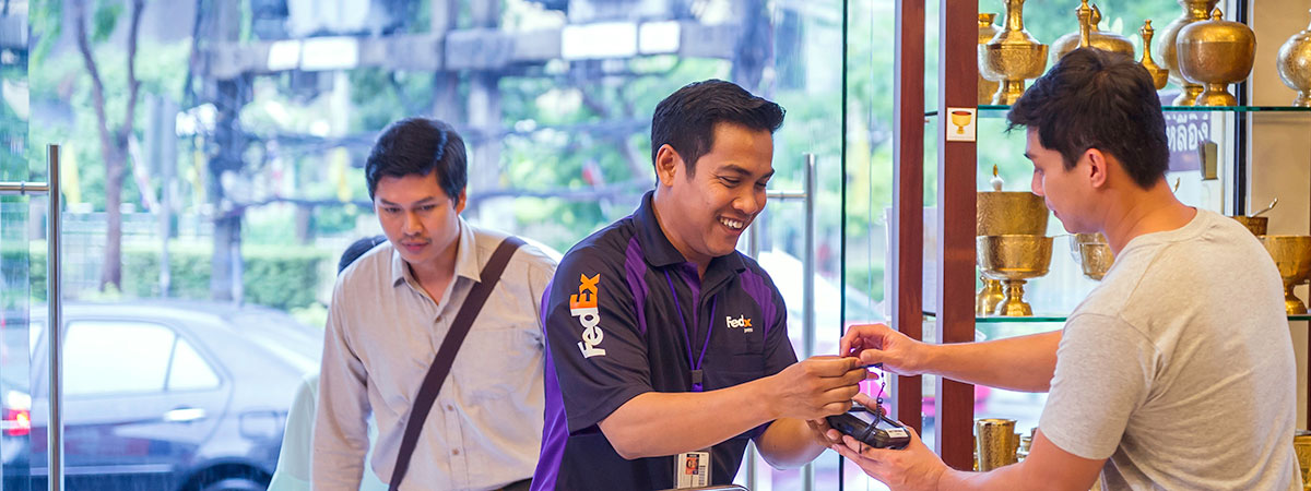 FedEx driver meeting with shop owner
