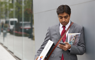 Man holding phone looking at the screen