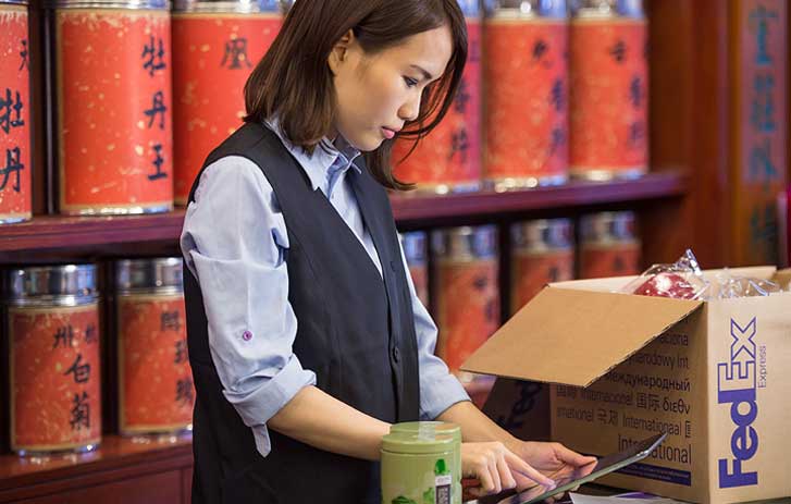 Women standing in front of merchandise