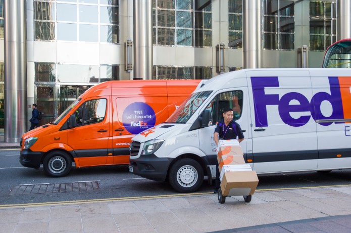 FedEx and TNT delivery vehicles