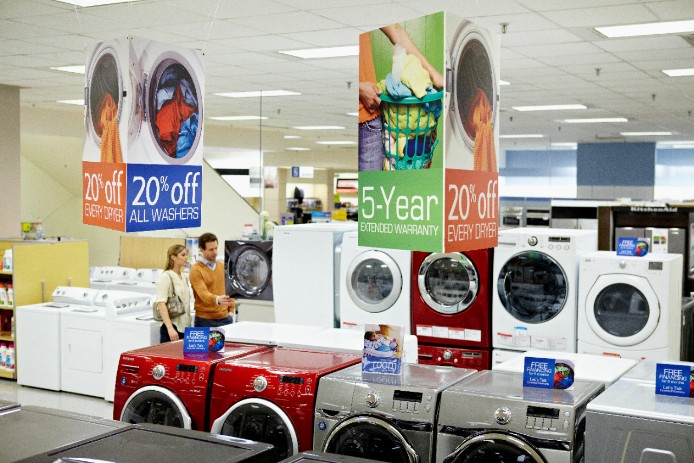 Vibrant signage displayed in the middle of a retail store