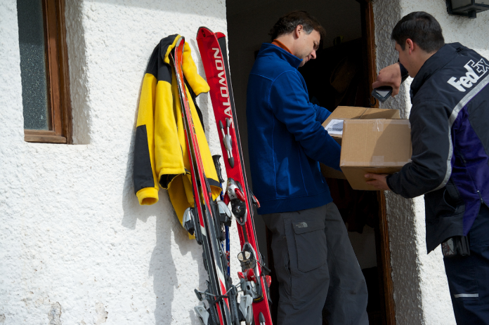 FedEx Delivering package at home