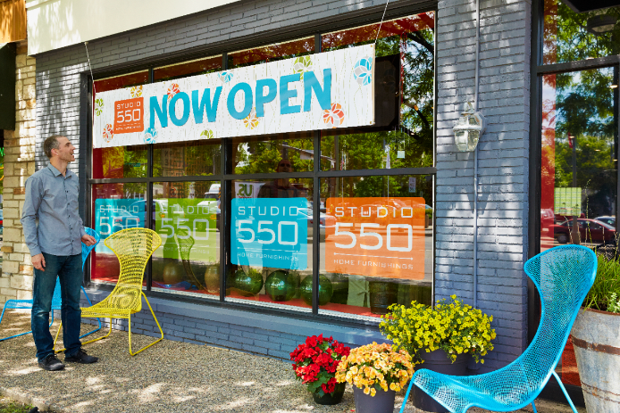 Outdoor Banner A customer walking by a now open outdoor banner