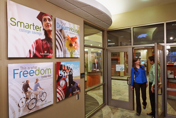 Photo posters hanging on wall Photo posters hanging inside of a bank