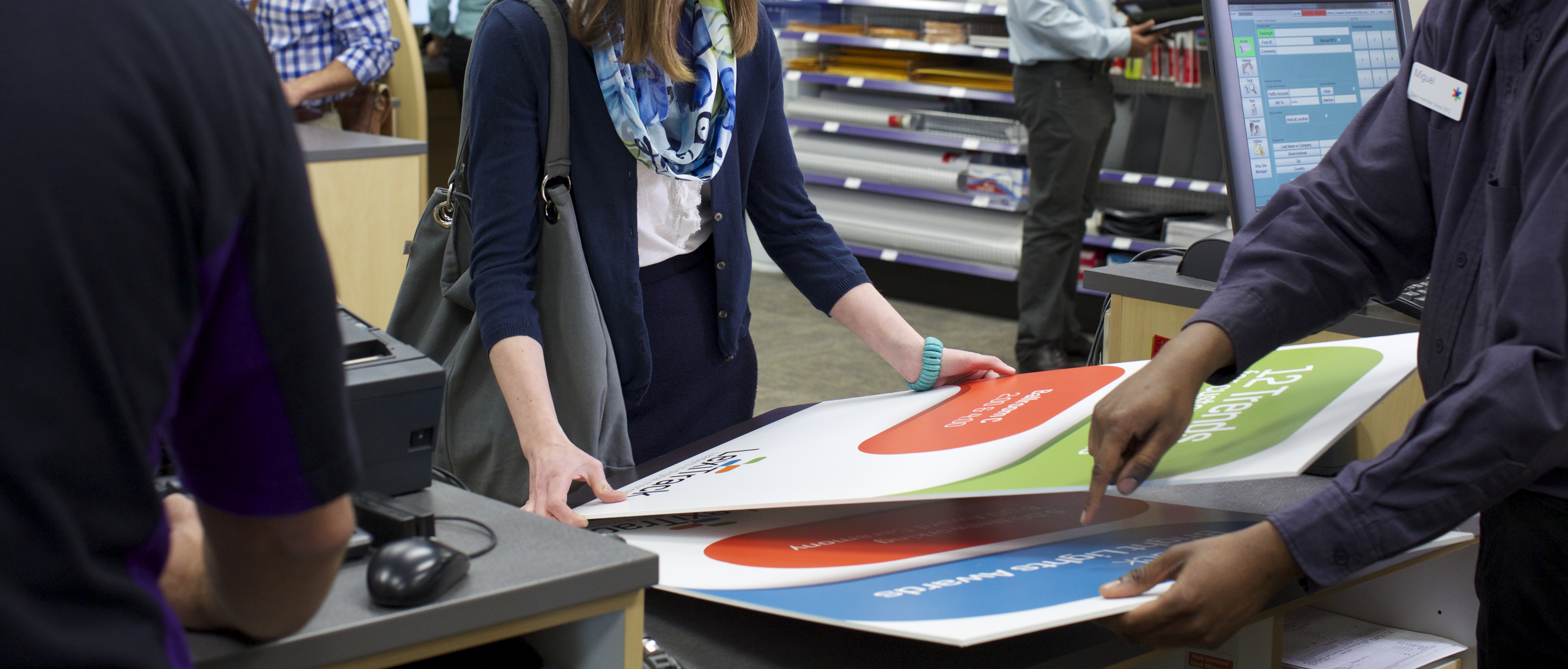 Customer examining poster print