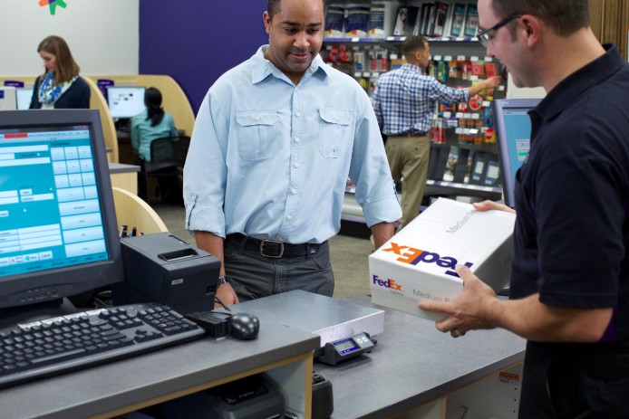 Man picking up FedEx package