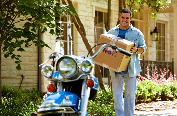 Man carrying FedEx box
