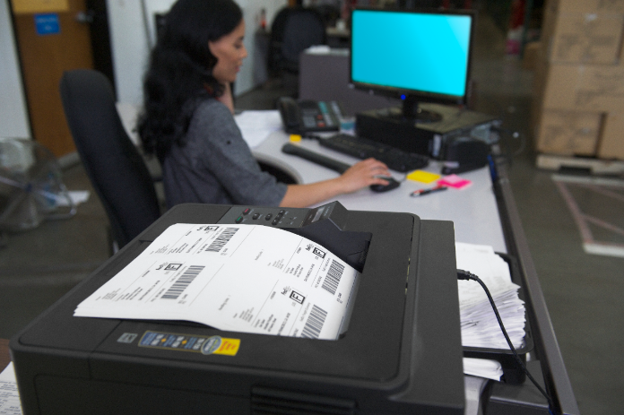 Woman printing out shipping labels