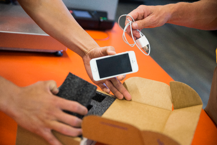 packing mobile device and charger in box