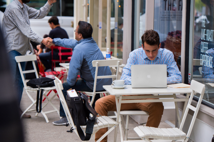 Man at restaurant on computer