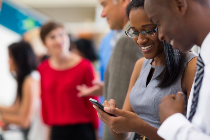 two people looking at cell phone together