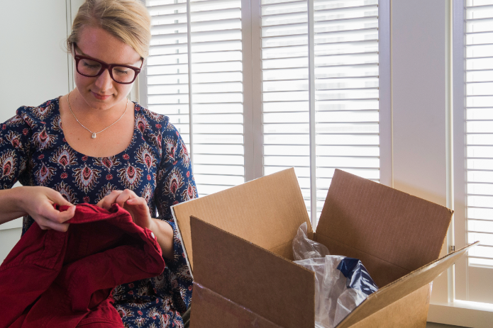 A customer prepares to re-package a return