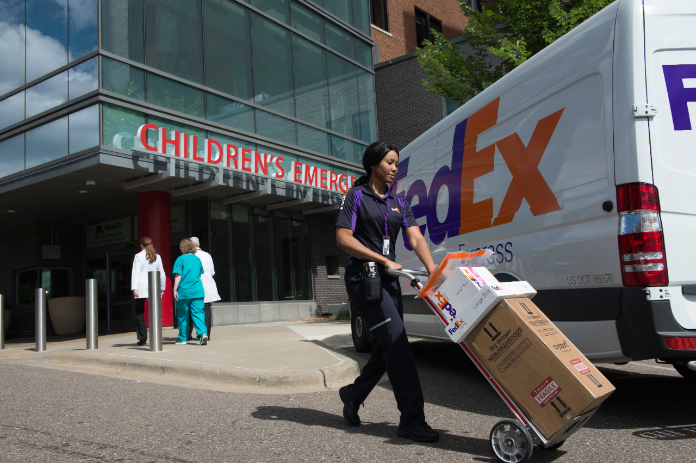 Courier picking up shipments at children's emergency entrance