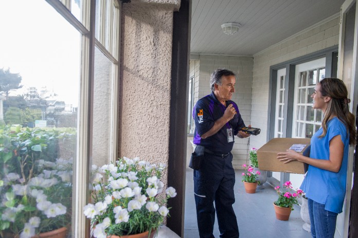 A FedEx courier delivers a unit-dose package of wound-care supplies to patient's home.