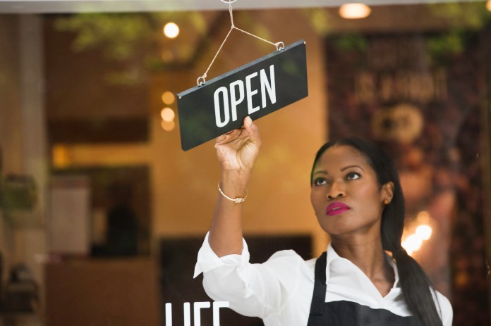woman with open sign