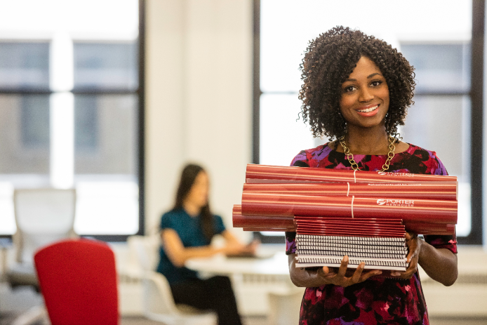 Corporate employee holding marketing materials Corporate employee holding marketing materials
