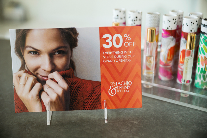 In-store discounts postcard A postcard display showing in-store discounts