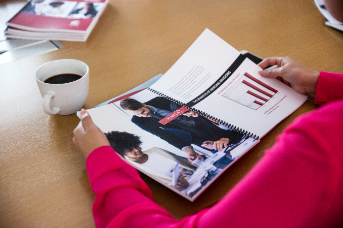 Business person looking through presentation Business person looking through presentation