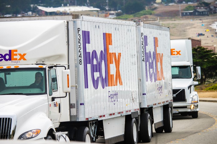FedEx Freight trucks traveling on highway