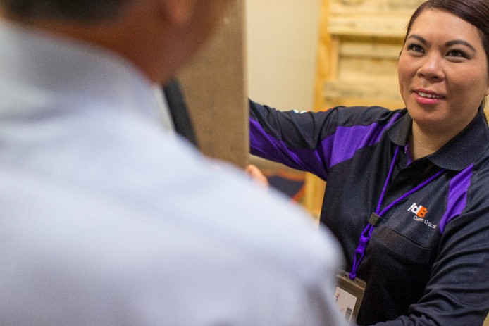 FedEx employee talking to customer