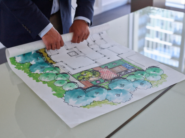 Rolling up an architectural print Customer rolling up an architectural print