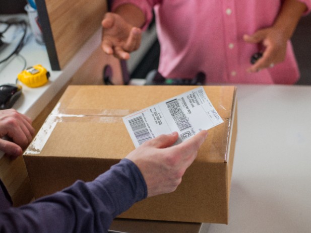 Person applying label to shipment