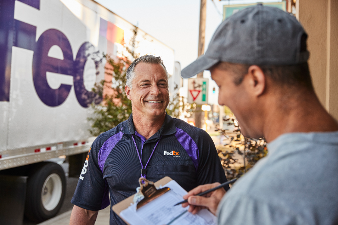 Customer signing off on package