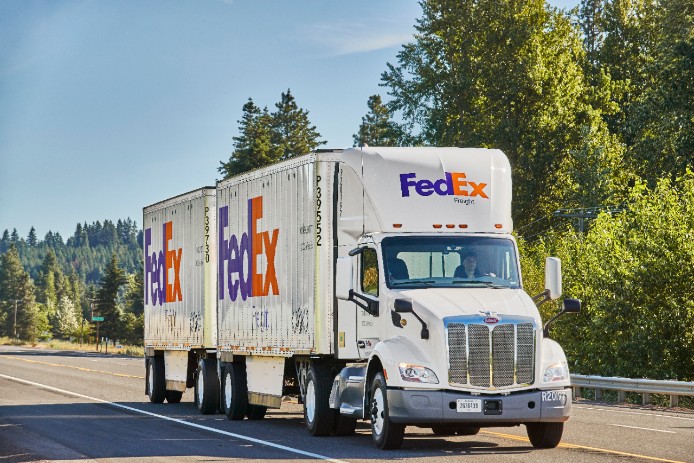 FedEx Freight truck driving down road