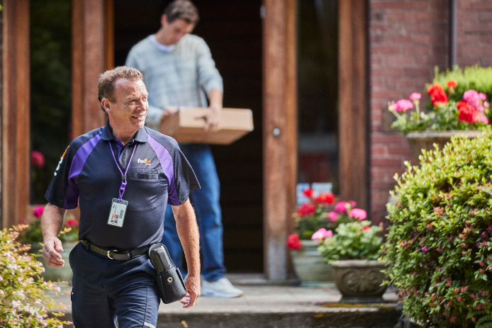 FedEx courier delivering a package