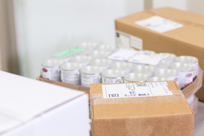 Close up of clear medicine bottles packed in a FedEx box.