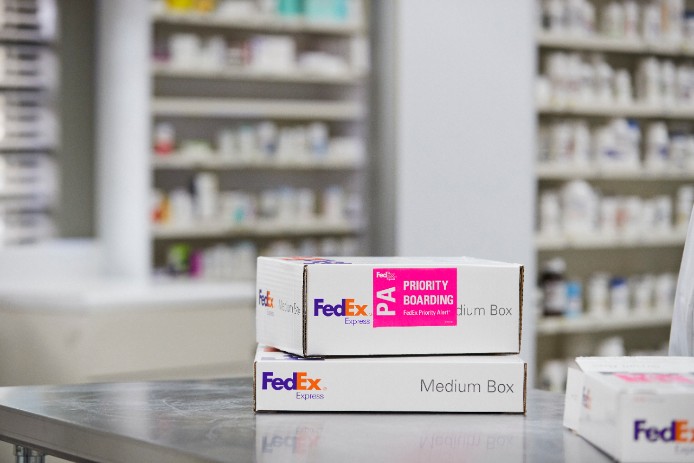 Close-up view of two medium FedEx Priority Alert packages.