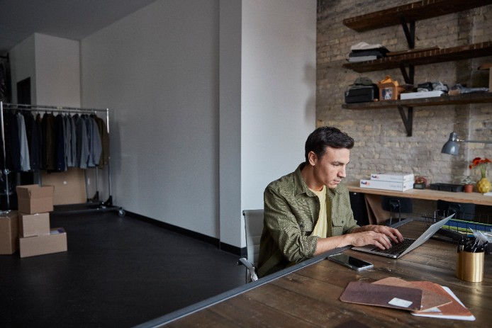 man looking at laptop