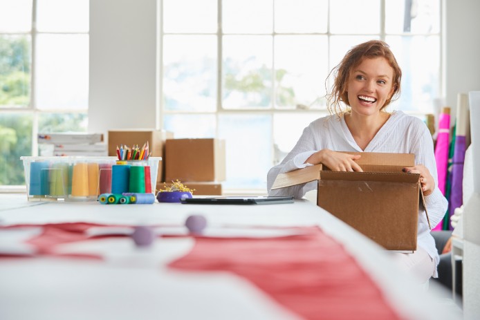 woman opening fedex package