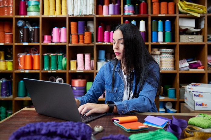 A small business owner prepares an international shipment.