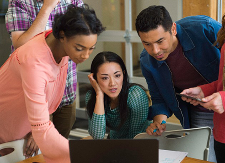 Friends looking at computer