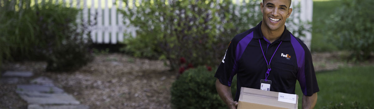 FedEx employee with package