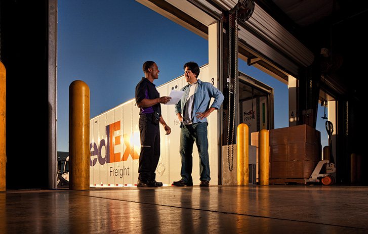 FedEx Freight courier with customer