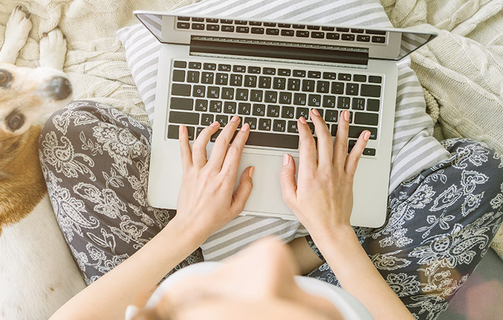 woman typing on laptop