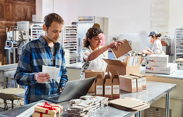 workers in store, packing boxes